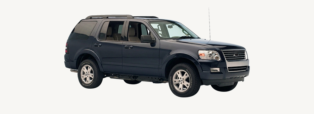 Cross bars installed on top of a black Ford Explorer.