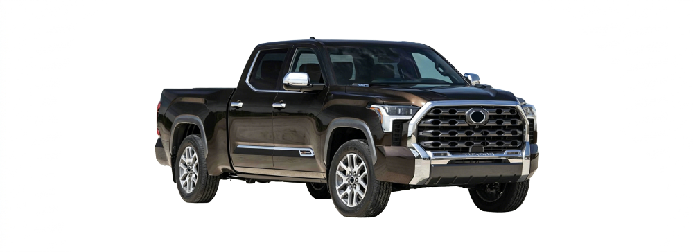 A dark grey Toyota Tundra parked in a brightly lit car showroom.