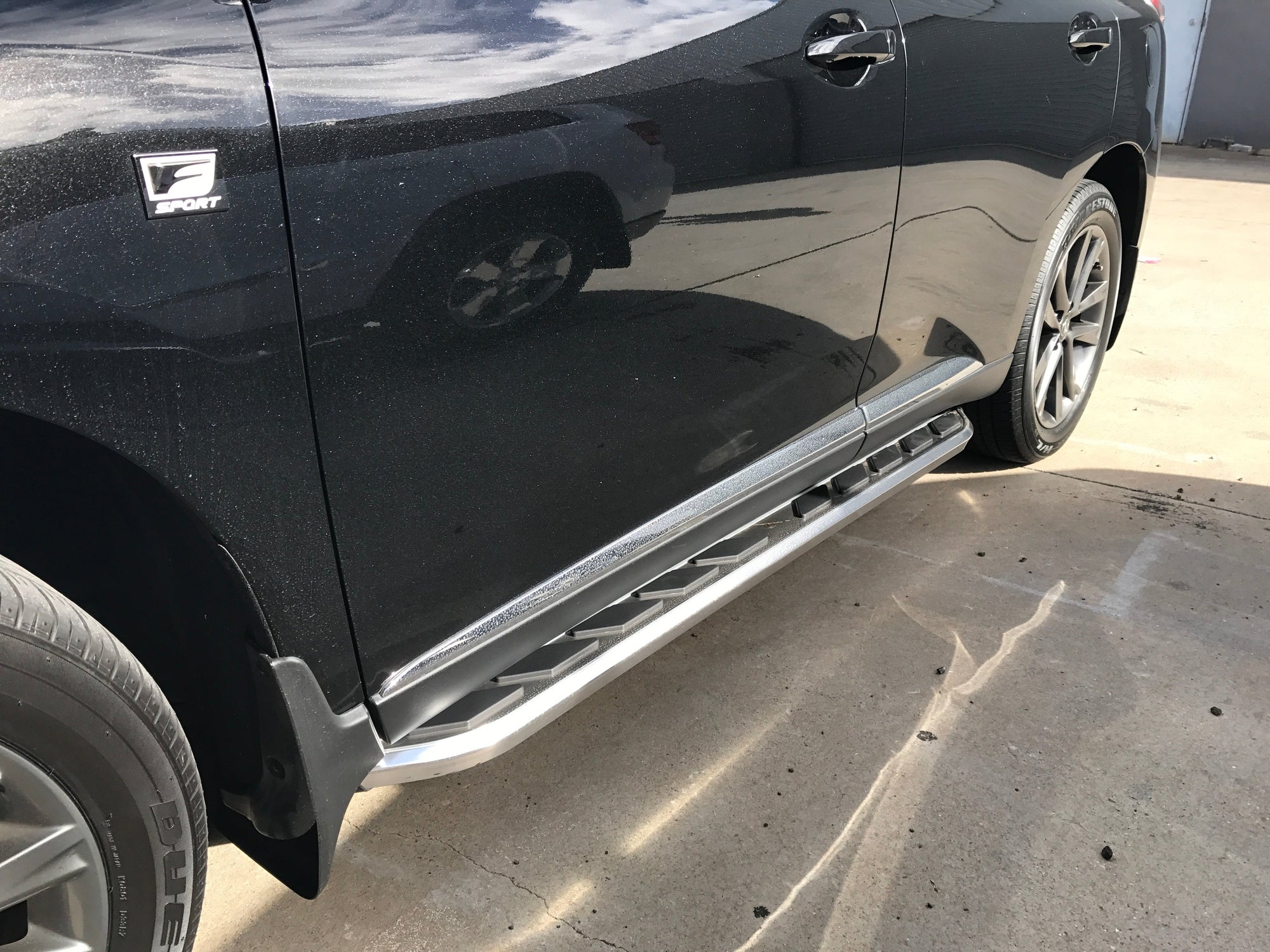 Side steps installed on a black Ford EcoSport
