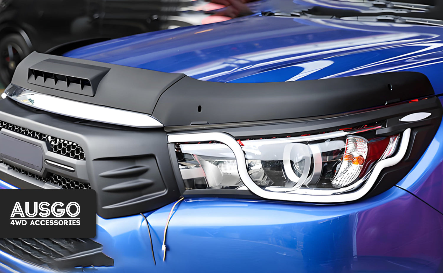 The front view of a blue Toyota HiLux.