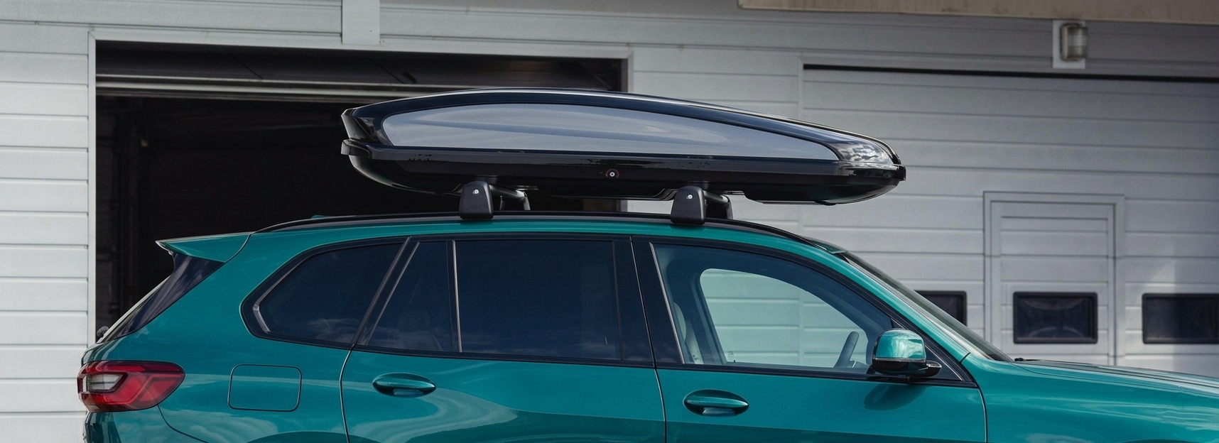 A top view of cross bars installed on a Black Ford vehicle