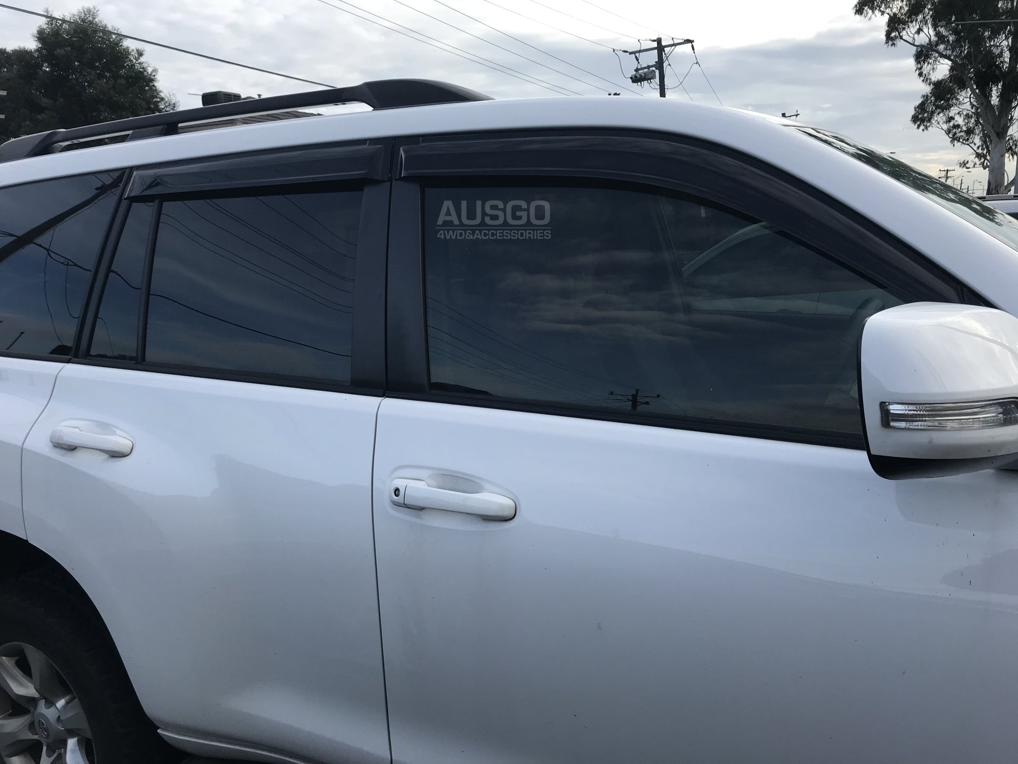 A silver Toyota Land Cruiser parked outdoors.